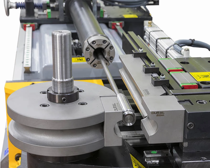 Operator programming a CNC tube bending machine