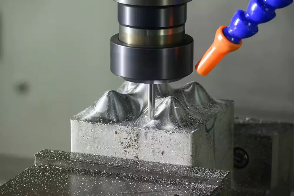 End mill cutter machining an internal pocket feature in CNC aluminum part