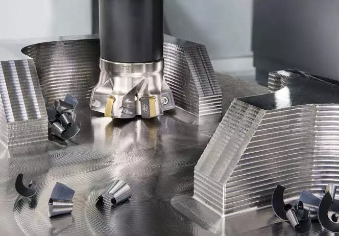 Face milling cutter machining a flat reference surface on CNC aluminum part
