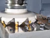 CNC face milling operation machining a flat aluminum surface with face mill cutter