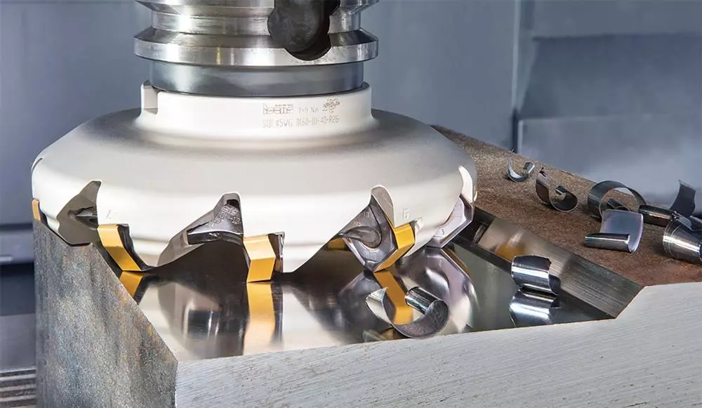 CNC face milling operation machining a flat aluminum surface with face mill cutter